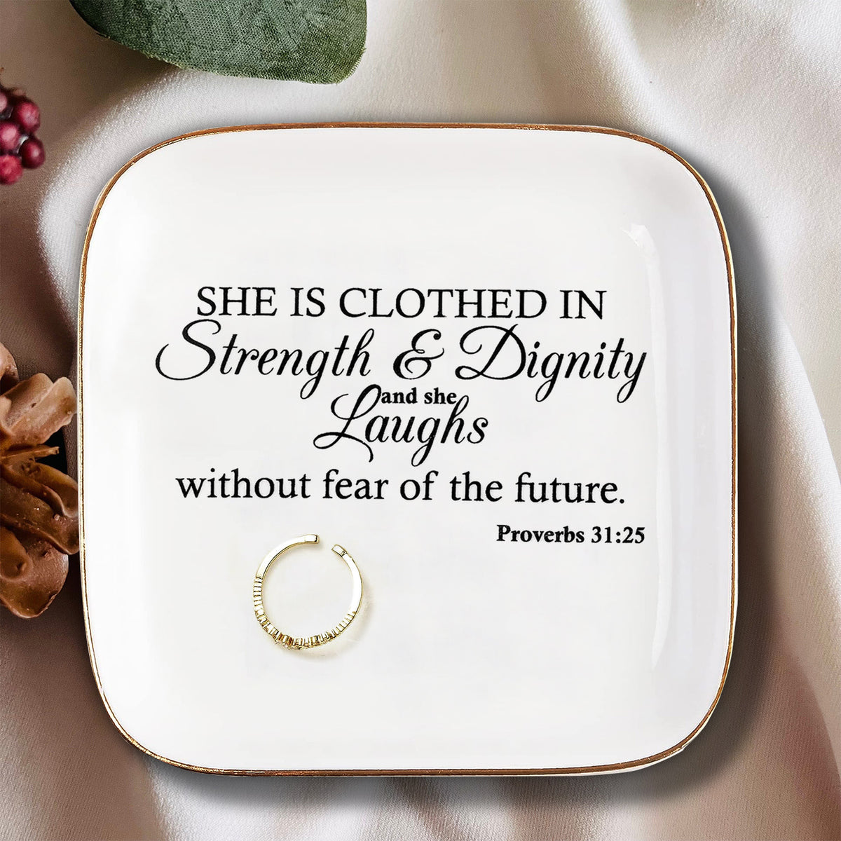 She is clothed in Strength Inspirational Gifts for Women Ceramic Ring Dish Birthday Gifts for Women Unique, Best Friends Gifts For Women Her Mom Sister Coworker